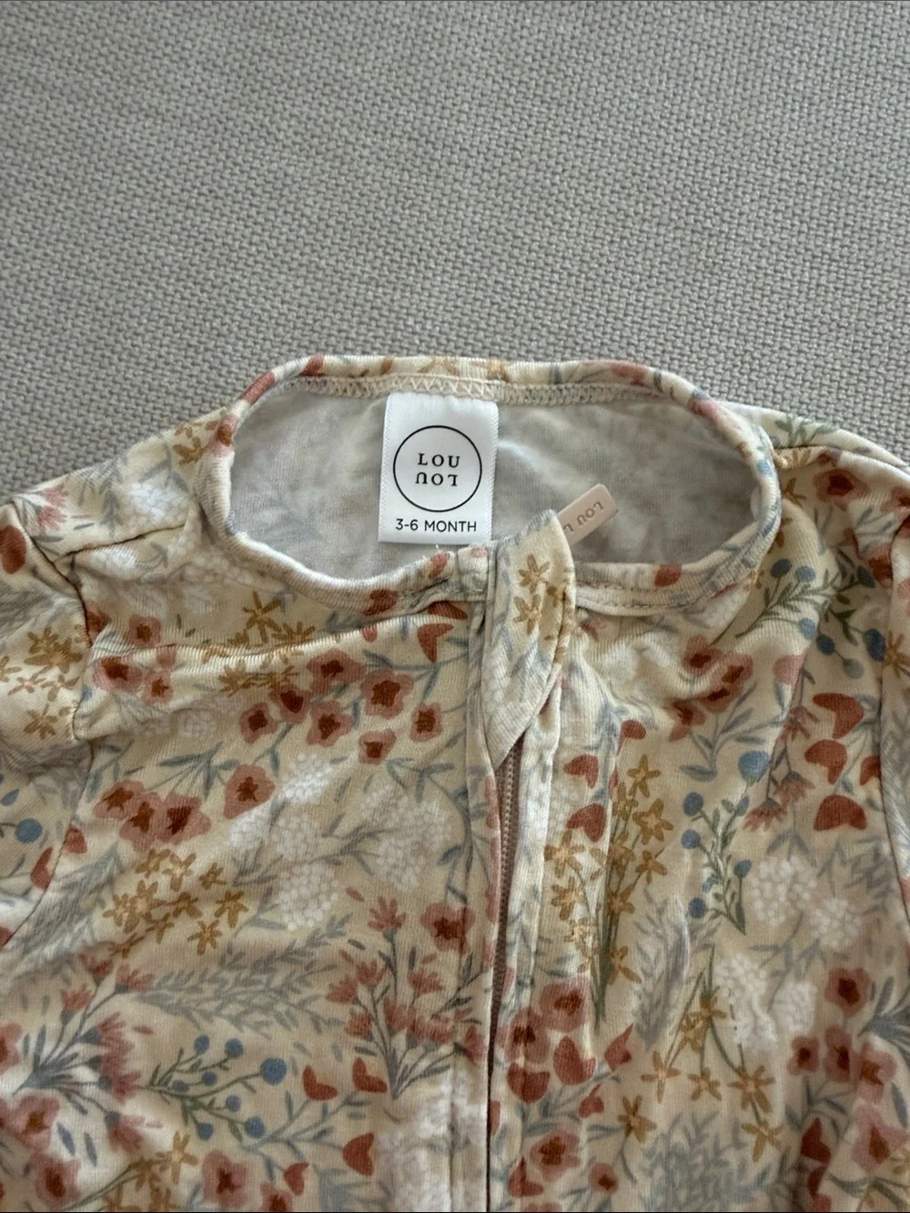 Lou Lou & Company Cream Floral Footed One-Piece Pajamas with Rust & Blue Accents